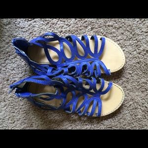 Blue sandals with zipper backs.